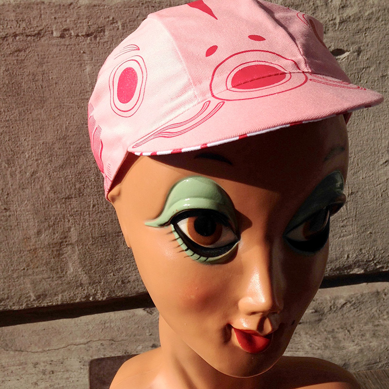 light pink and ruby red cycling cap with koinobori design