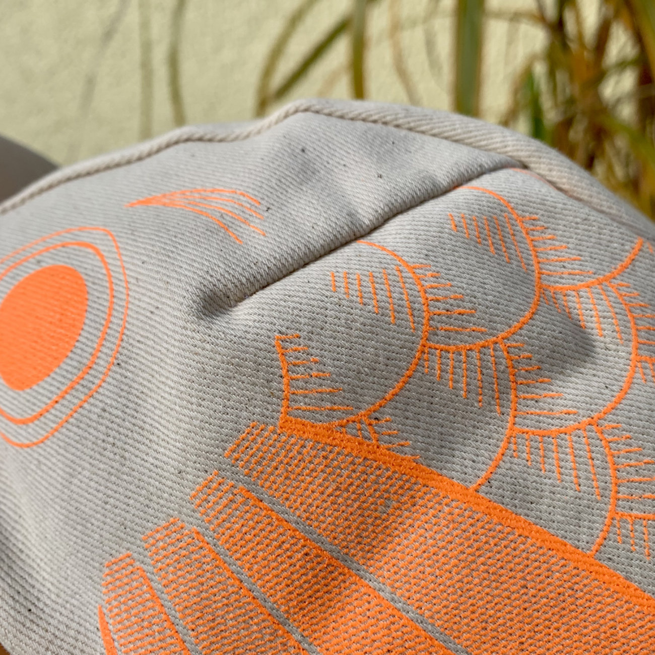 neon orange color print on undyed fabric Koinobori cycling cap